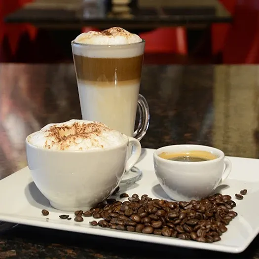 Symposium Cafe Restaurant beverage menu featuring specialty coffees, smoothies, milkshakes, juices and Italian sodas.