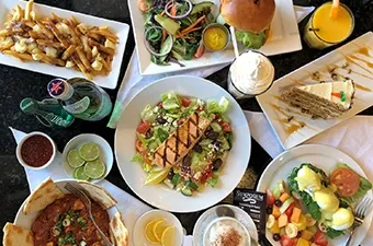 Symposium Cafe Restaurant lunch and dinner spread featuring burgers, pasta, seafood and satisfying entrées.